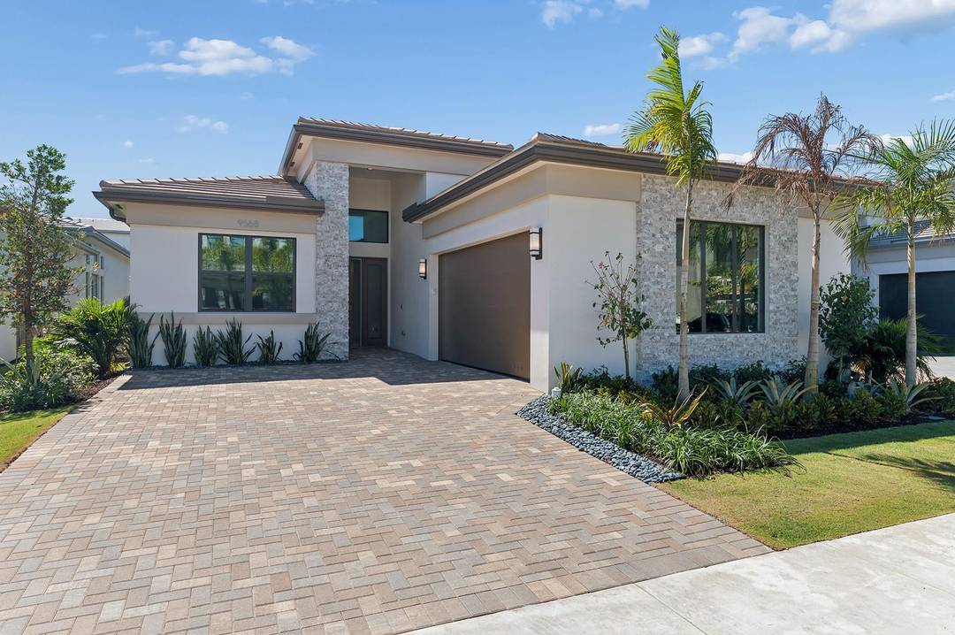 Discover elevated living in the guard gated community of Lotus Edge, where tropical landscaping and a 90K SF clubhouse with luxury amenities create a true resort style setting.