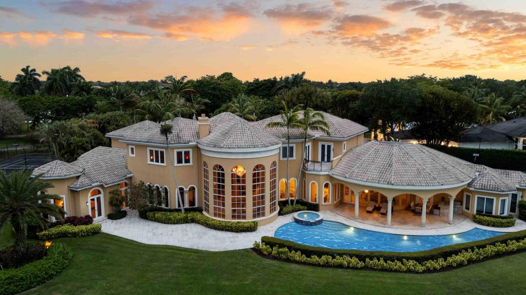 Step into a world of timeless elegance and unmatched luxury with this stunning 2 story estate in Boca Raton's exclusive Long Lake Estates.