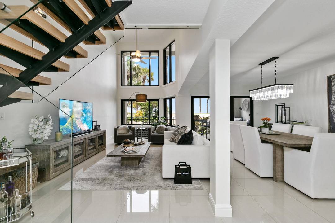 Beautifully renovated two story condo that lives like a townhouse just steps away from the beach.