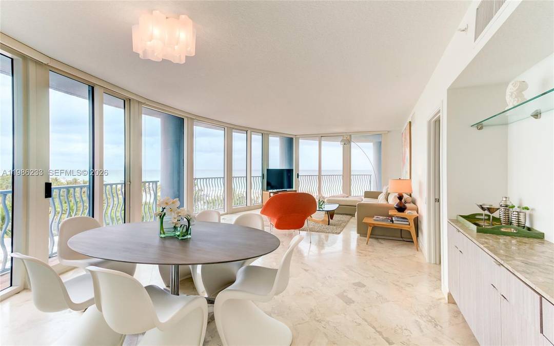 Direct Oceanfront 3BR Den office NE corner residence at The Michael Graves featuring Saturnia marble floors throughout, a new kitchen, and a renovated primary bath.