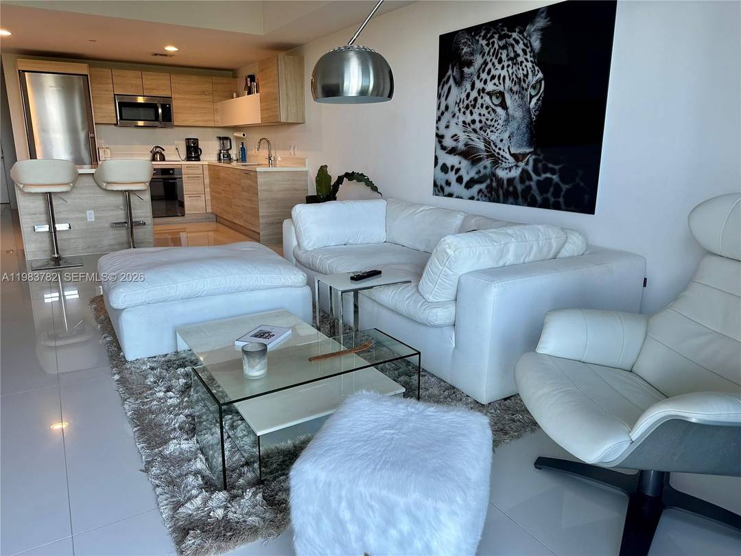 Experience waterfront living in this beautiful 2BD 2BA den residence at The Harbour Condominium, offering stunning canal and bay views alongside the natural beauty of Oleta River State Park.