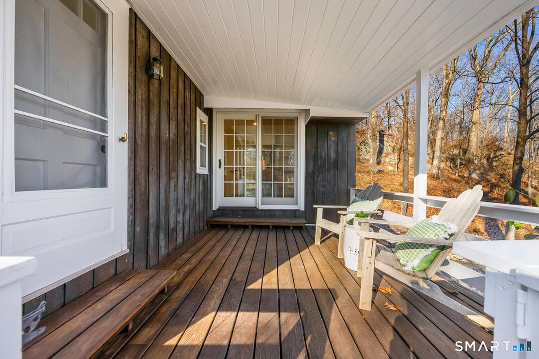 Welcome to this enchanting midcentury cottage in coveted South Wilton, where privacy meets everyday convenience.