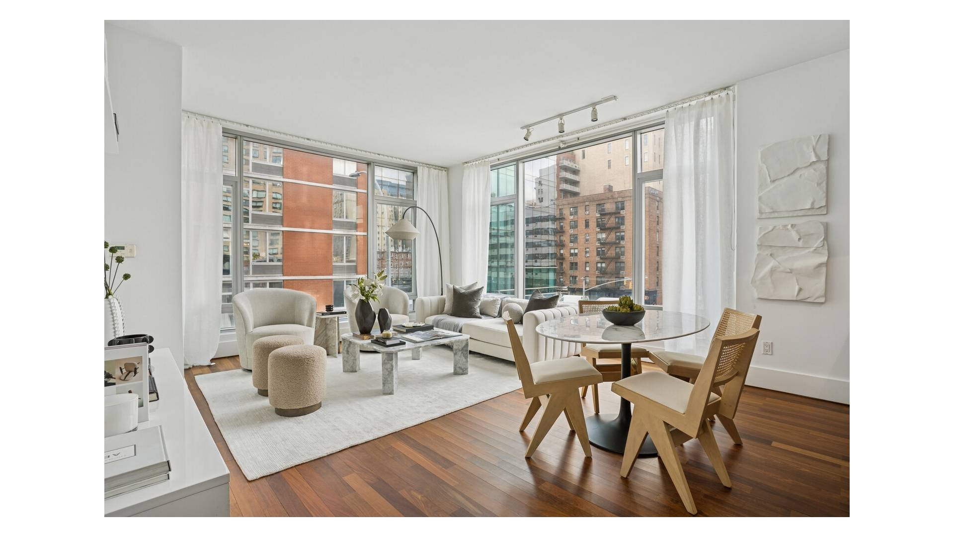 This exceptional two bedroom, two bathroom residence features a welcoming entry foyer that opens to an expansive corner living room framed by a dramatic wall of windows that flood the ...