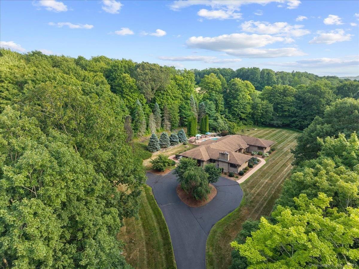 Vacation all year in this exquisite custom ranch on private 4 acre lot in sought after Durham.