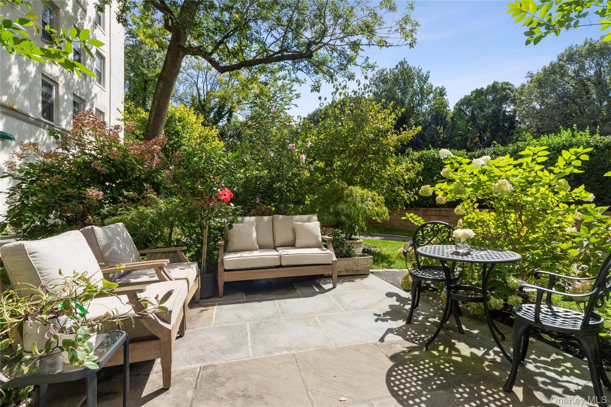 Nestled within a lush, secluded setting, this exquisite residence offers a rare blend of elegance, privacy, and timeless charm.