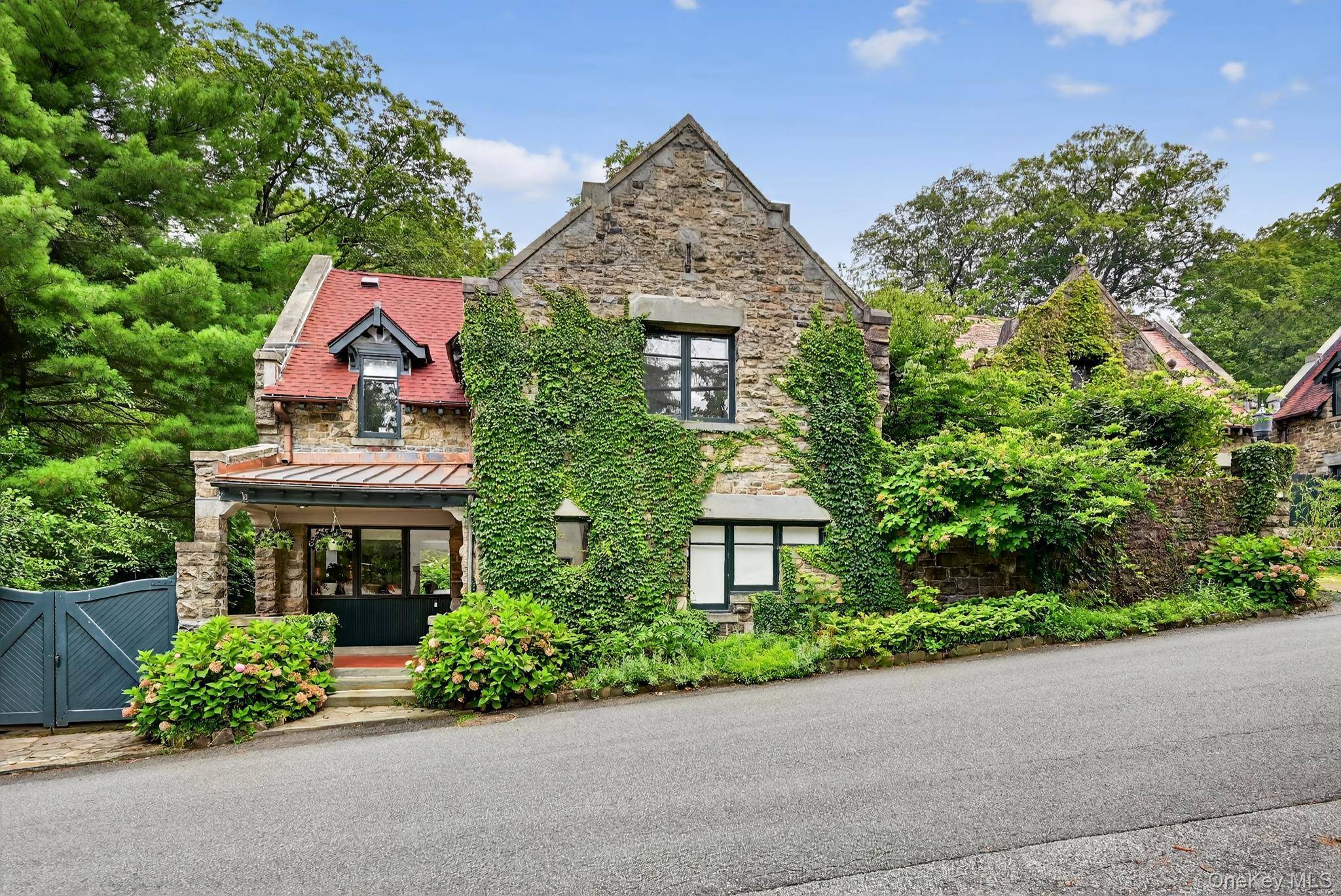The Cotswell Cottage and stone stable build in 1876, is within The Historic Village and gated community of Tuxedo Park.