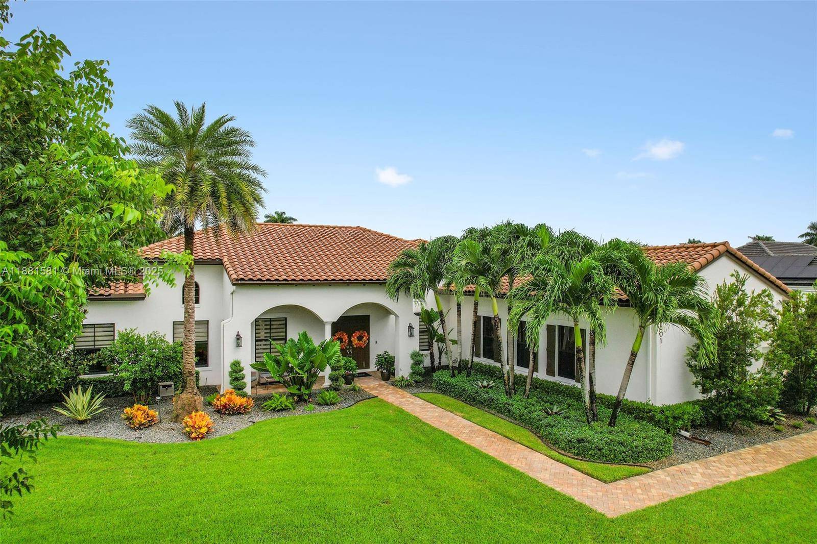 Contemporary Mediterranean estate in gated Camelot Estates, an Enclave of only 19 homes.