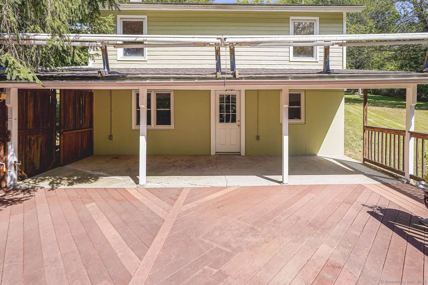 Discover the charm of lakeside living on peaceful Quasset Lake in Woodstock, CT.