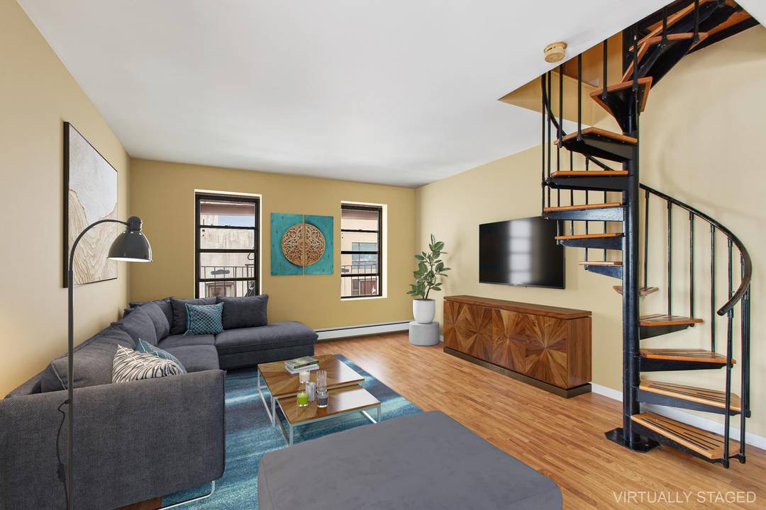 Massive South Slope Duplex with Three Bedrooms, Three Full Bathrooms, and a Private Roof Deck !