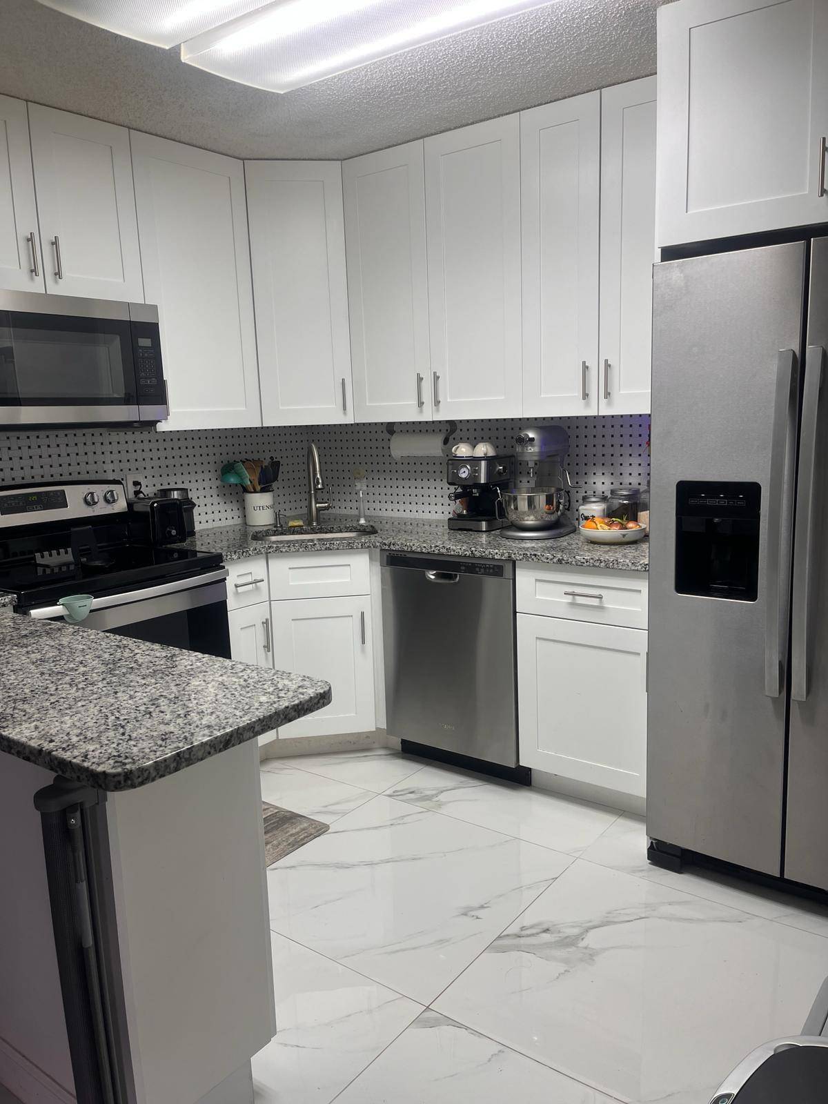 Beautifully remodeled modern 2 2 unit with a lakeview in the heart of WPB.