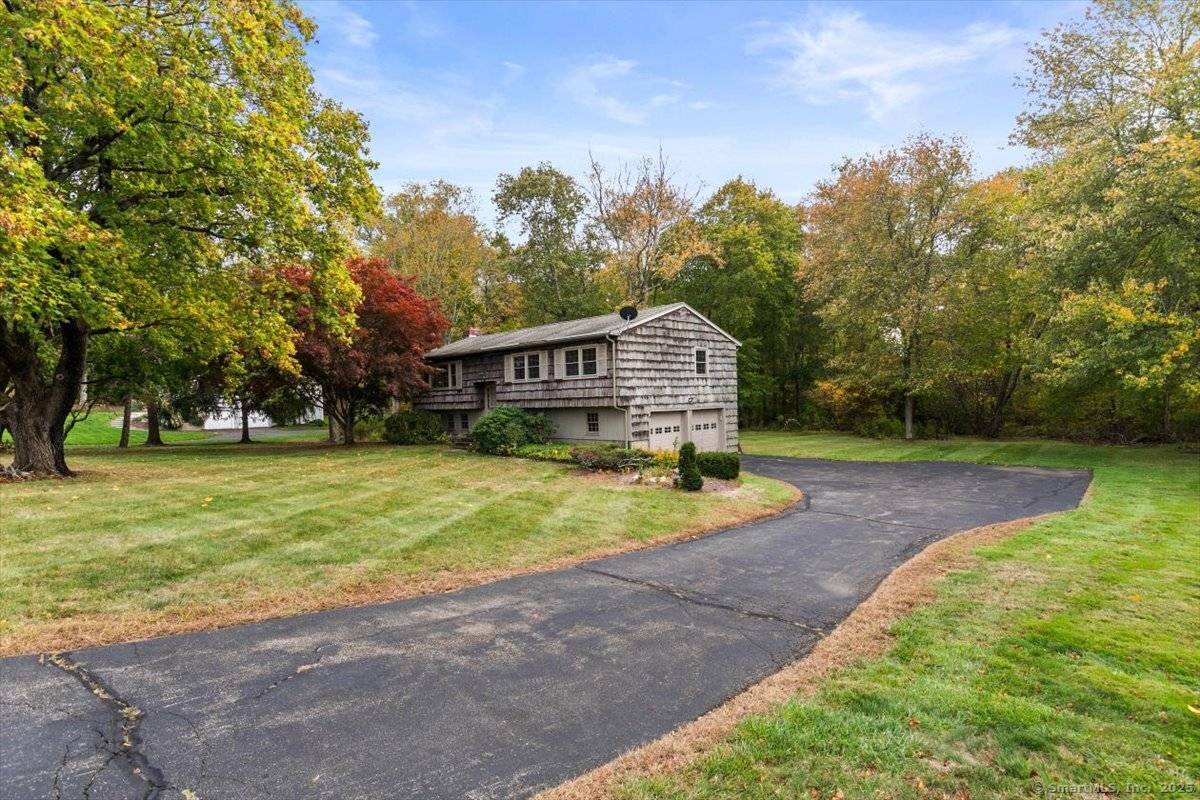 Nestled in the desirable Grassy Hill Golf Course neighborhood, this lovingly maintained raised ranch is ready for its next chapter.