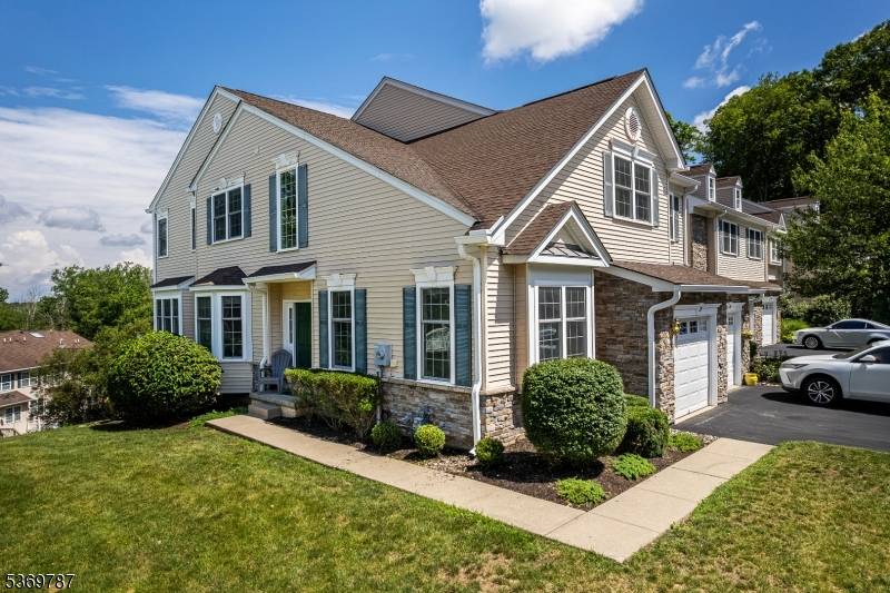 Welcome to this sun filled Morris Chase Carriage Home, an end unit Carlyle Model offering thoughtful design flexible space.