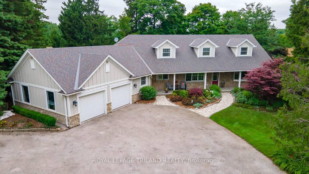 Discover the perfect balance of space, privacy, and convenience with this exceptional country estate situated just steps outside London's city limits.
