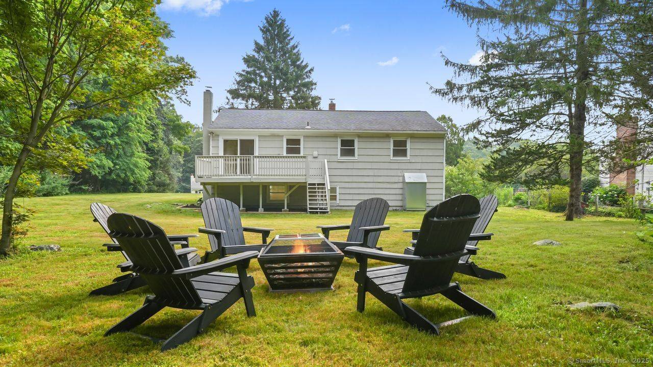 Step into this newly renovated Candlewood Lake home, where New England charm blends seamlessly with modern updates.