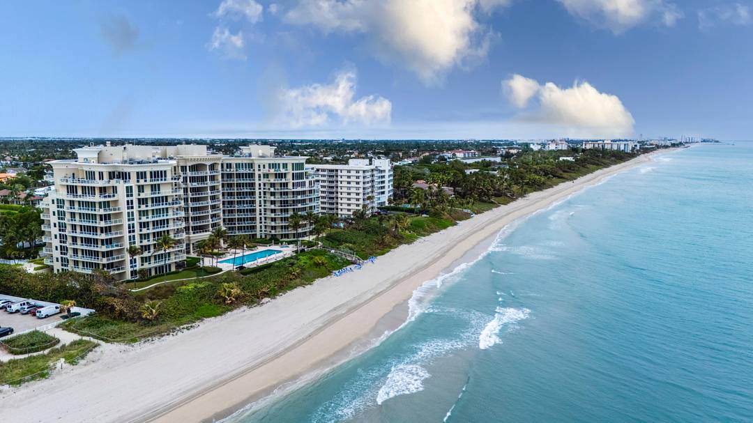 Exceptional two bedroom, two and one half bath corner residence on the prestigious Hillsboro Mile.