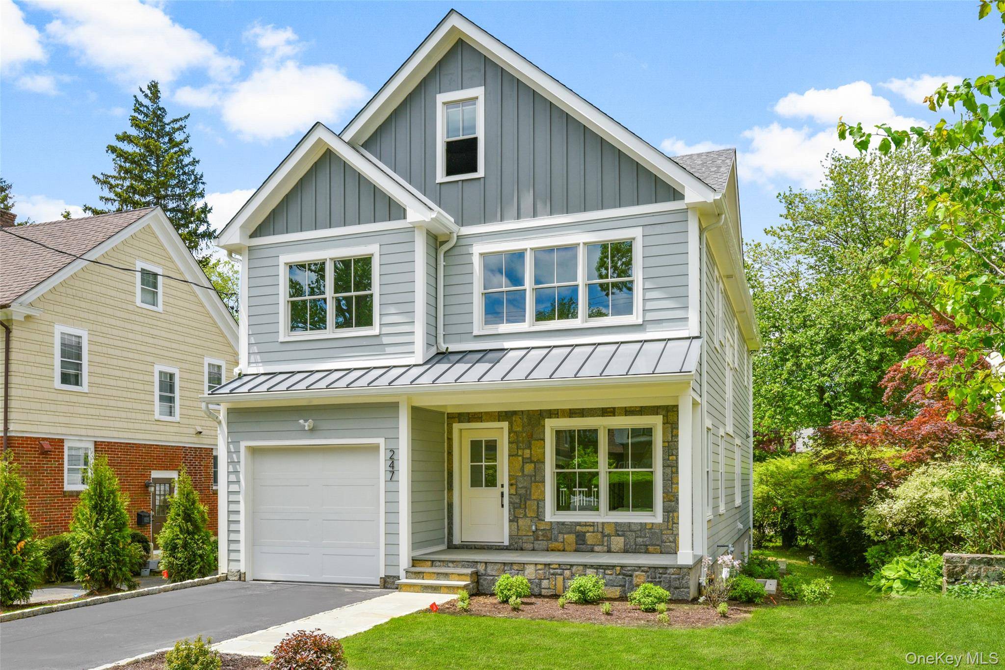 Experience refined living in this newly constructed Colonial nestled in prestigious Scarsdale Village.