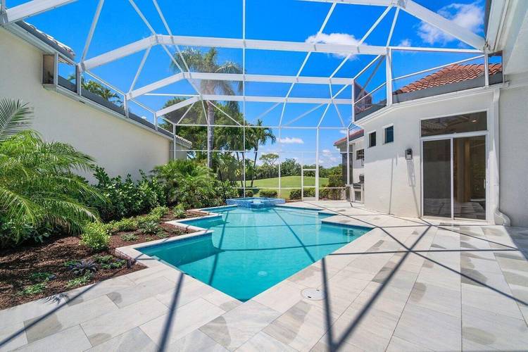 Stunning Newly Furnished and Renovated Modern Ballenisles Pool home with detached guest house.