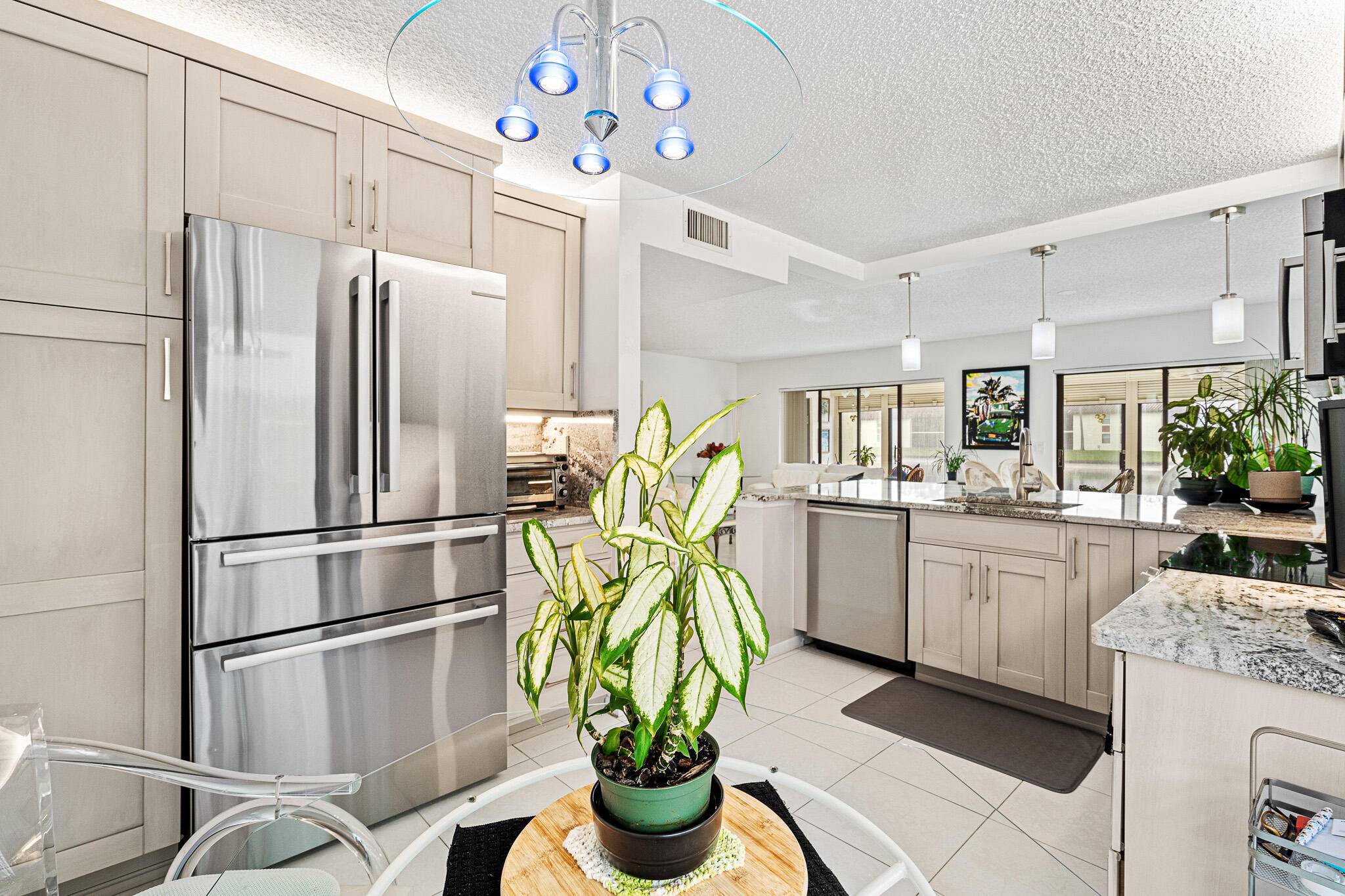 This Exquisite Lake View 3 Bedroom, 2 Bath, 1st floor Condo is a visual delight, featuring everything redone that sets the stage for elegance.