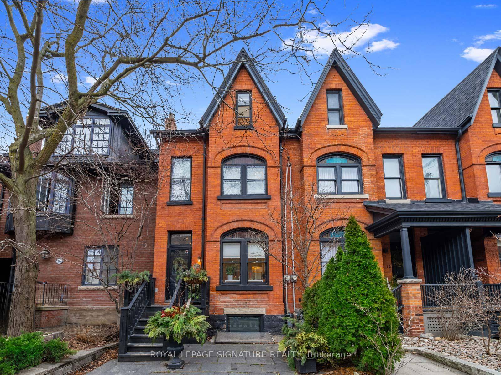 Magnificent, stately, red brick Heritage Victorian On One Of The Finest Tree Lined Streets In the city !