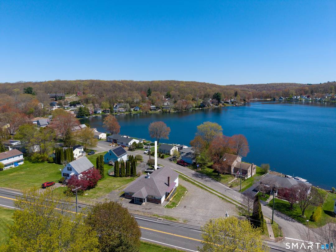 Exceptional redevelopment opportunity at 305 South Street in Plymouth, CT, directly across from beautiful Plymouth Lake.