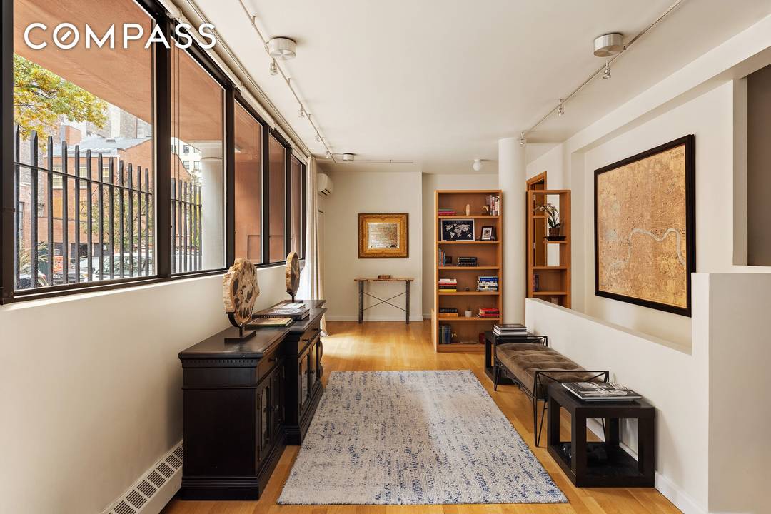 Set along a cobblestone street, just one block from Hudson River Park, 357 West 12th St, Residence 1E is an over 1, 800 square foot duplex composed for modern living.