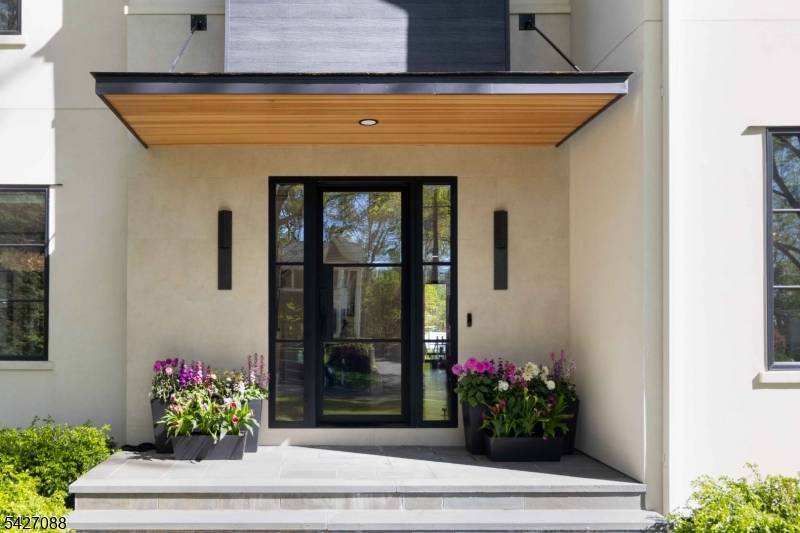 Set on a picturesque half acre in the heart of the Rolling Hill neighborhood, this stunning custom contemporary offers 4 fin lvls, 7 bdrms, 7 full 1 half bath, blending ...
