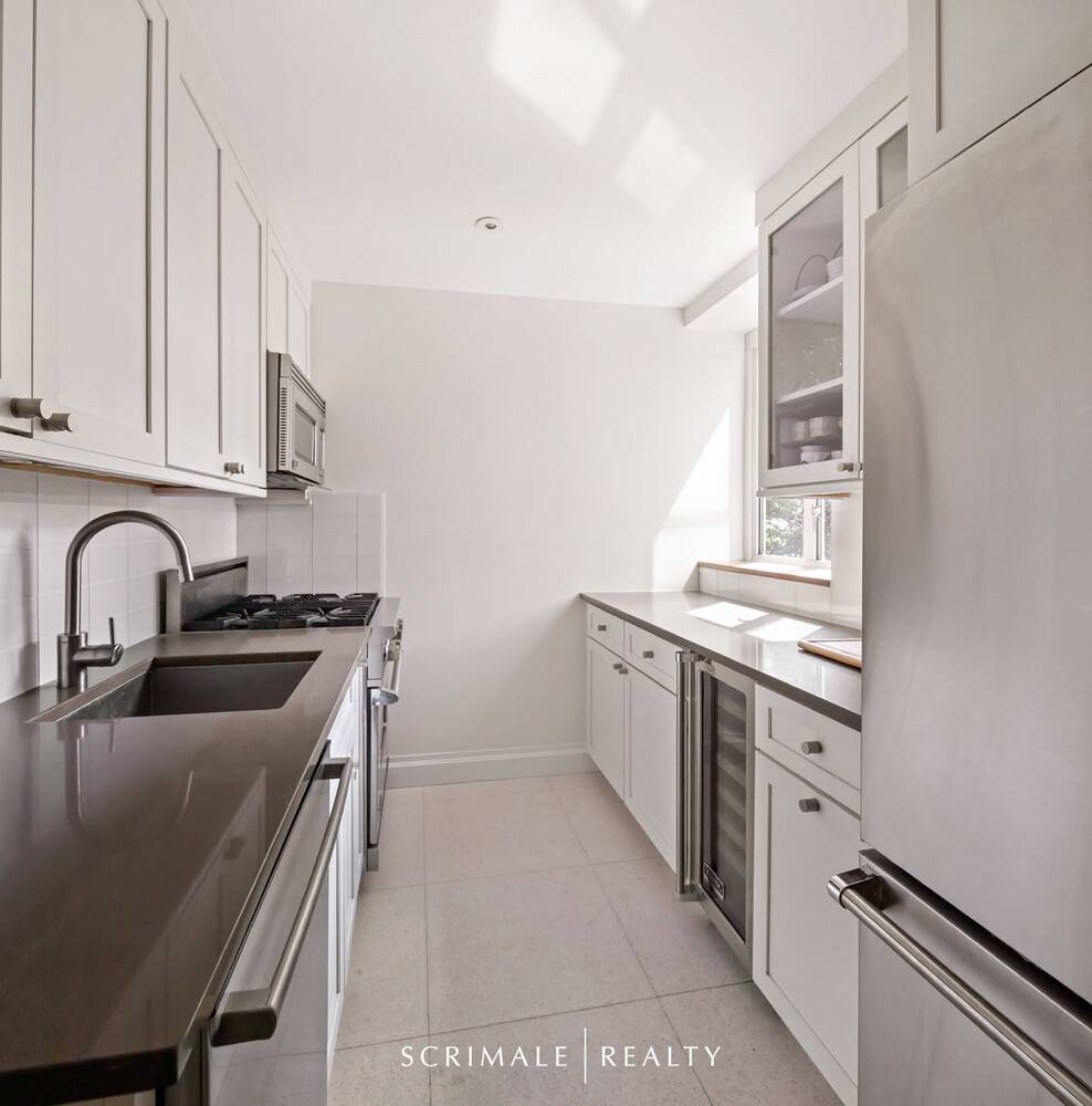 This lovely split two bedroom, two bath home offers bright north and east exposures, filling the living room with natural light and offering serene treetops views.