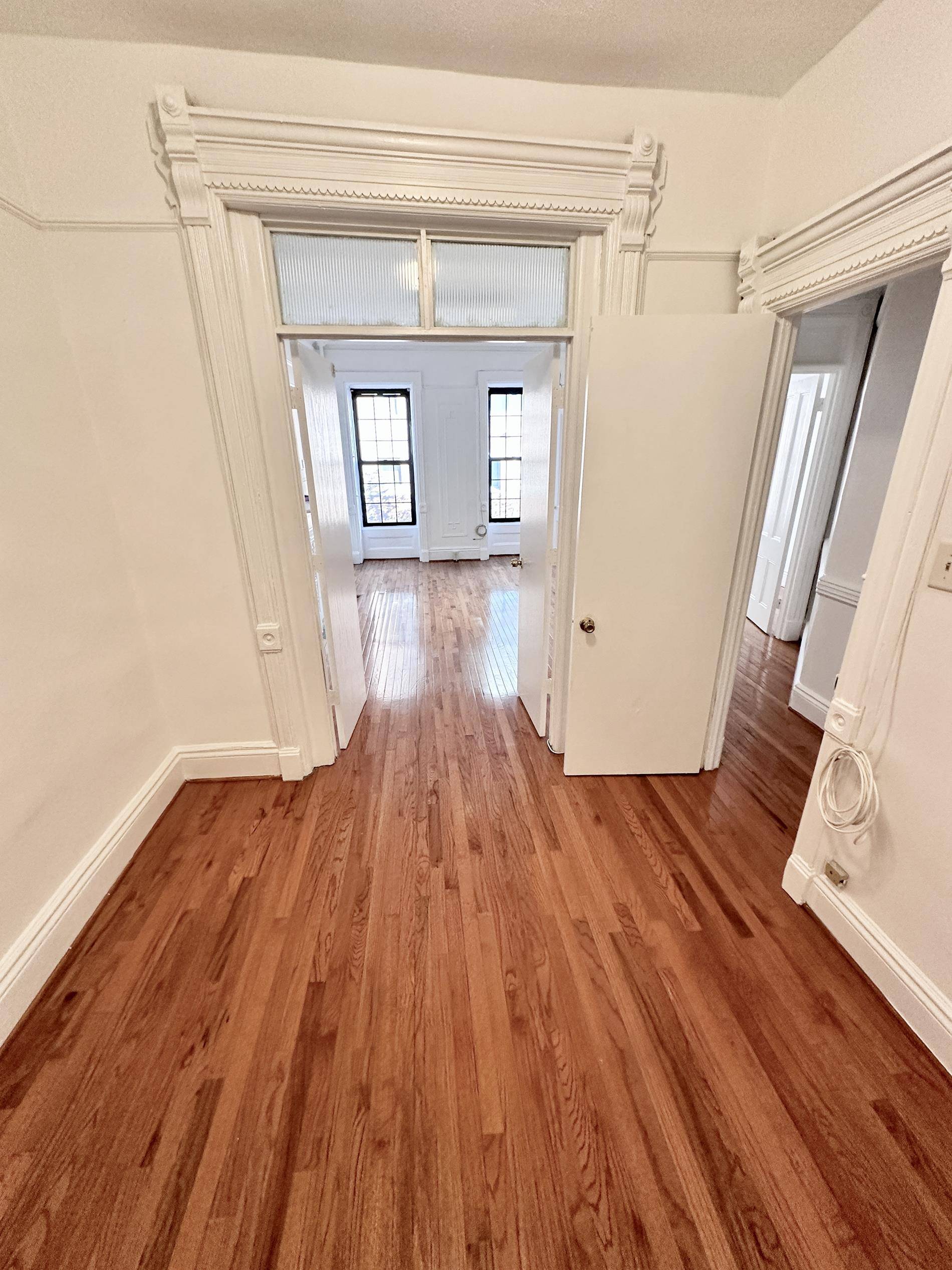 Large Center Park Slope 2 Bedroom plus bonus middle room in a classic brownstone with high ceilings and many original details such as hardwood floors, mantles and large windows.