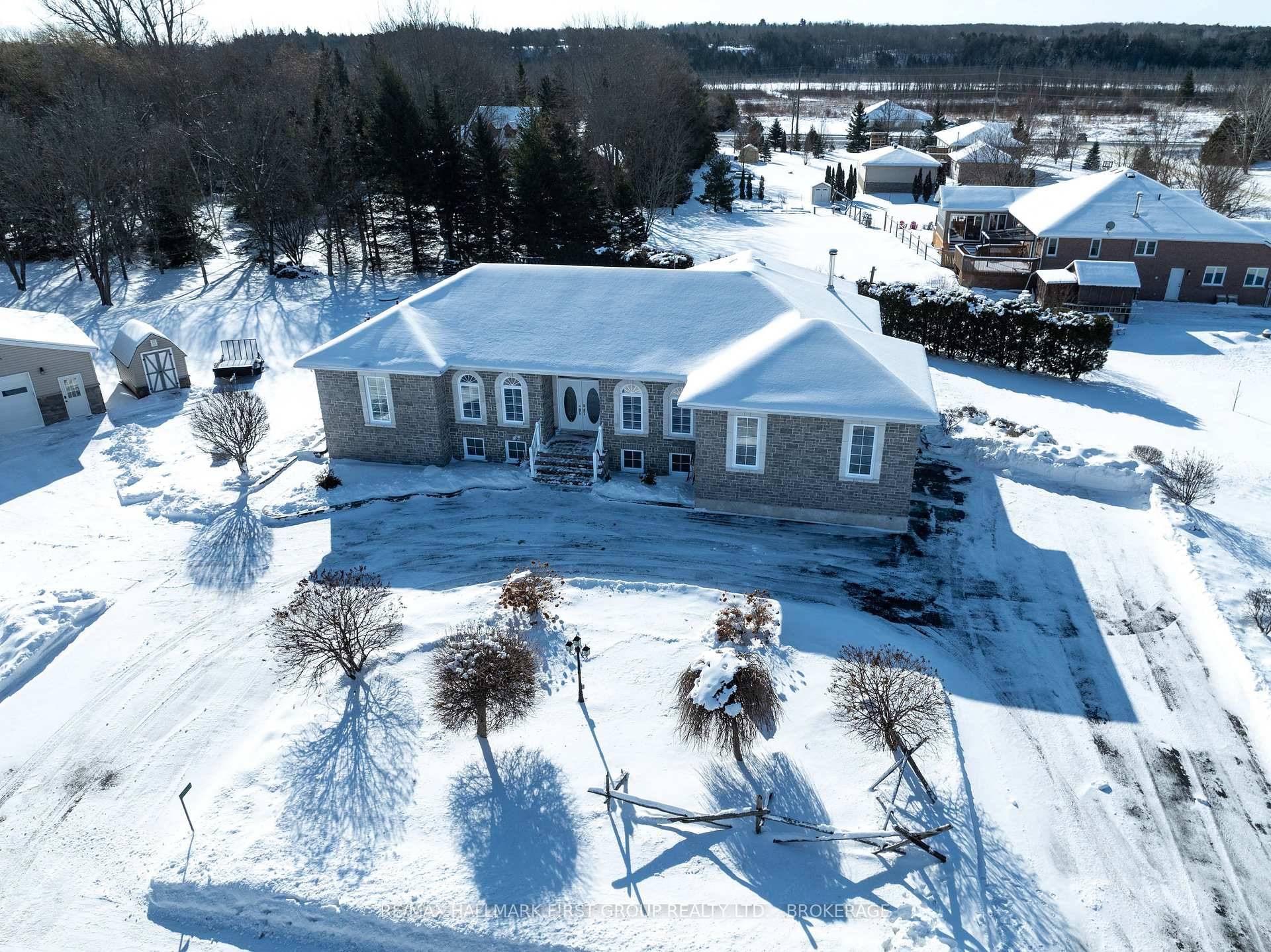 This luxury all brick and stone bungalow, sitting on just over an acre, is located in an exclusive executive subdivision on the edge of Sydenham.