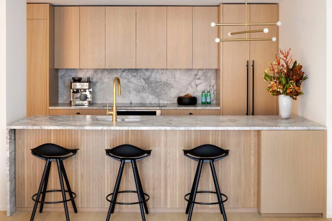 Early 2026 Closings Residence 3E is a gracious one bedroom, one and a half bathroom residence spanning 980 square feet, thoughtfully planned to include a windowed home office.