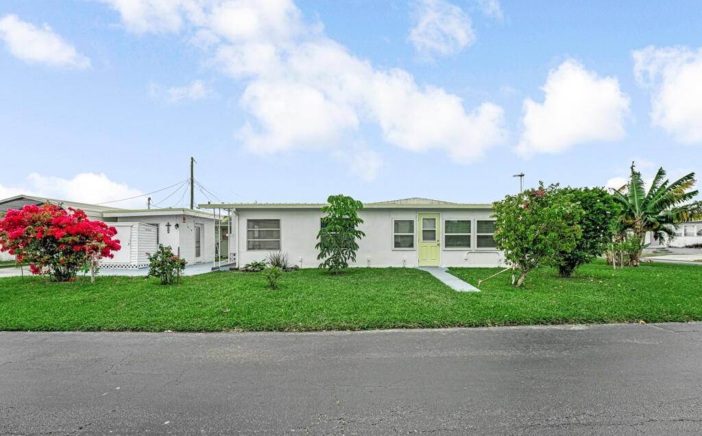 Nestled in one of the area's rare communities where you own the land, this charming home offers a serene garden view and a welcoming neighborhood atmosphere.