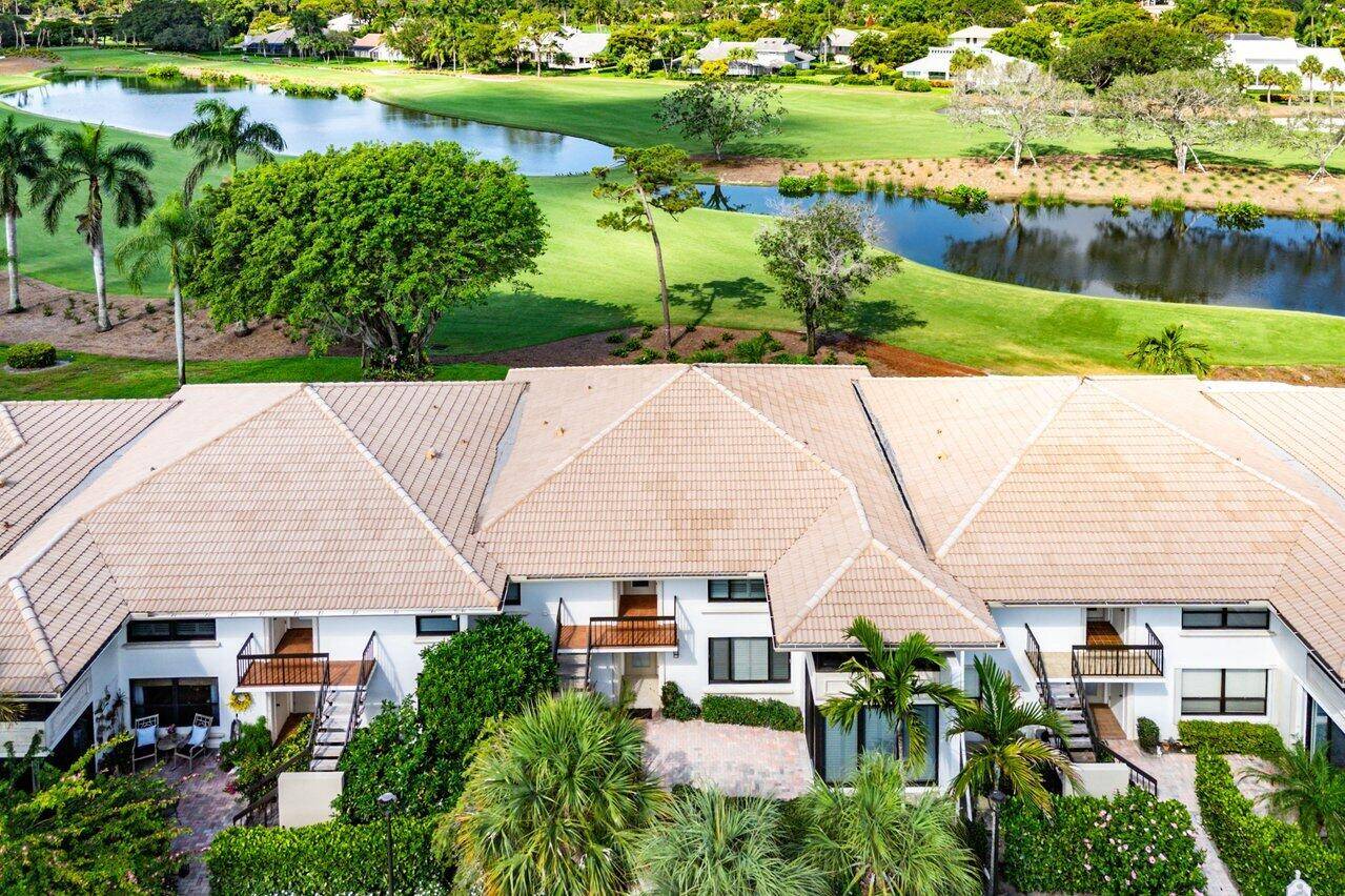 Experience luxurious living in this beautifully renovated 2nd floor, 3 bedroom, 2 bath condominium, showcasing breathtaking double lake and fairway views.