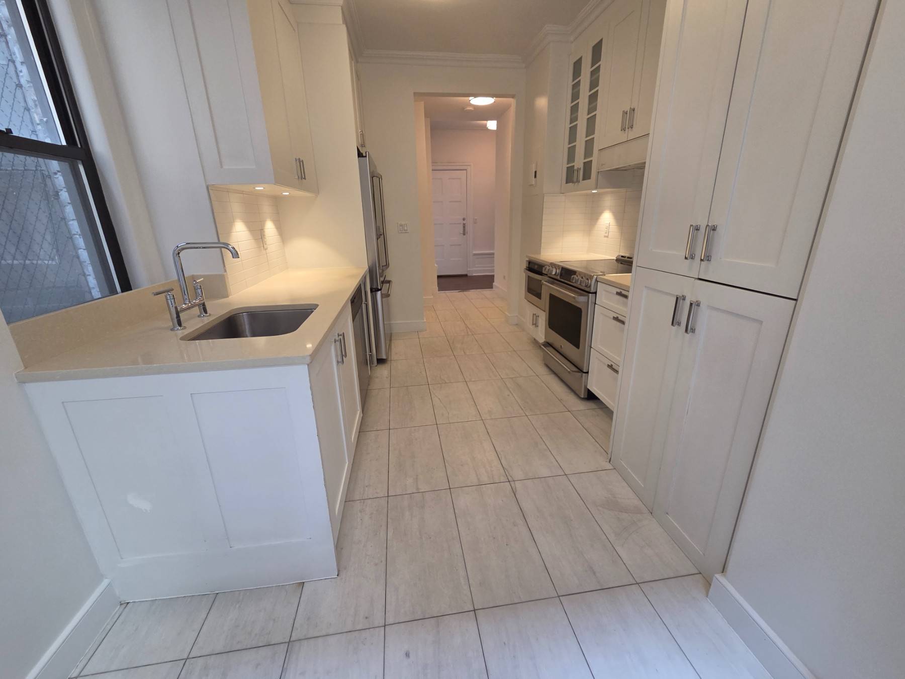 This gorgeous 3 bedroom 2 bath residence features high ceilings, pre war details, updated kitchen finishes, in home washer amp ; dryer, beautiful bay windows and a decorative fireplace.