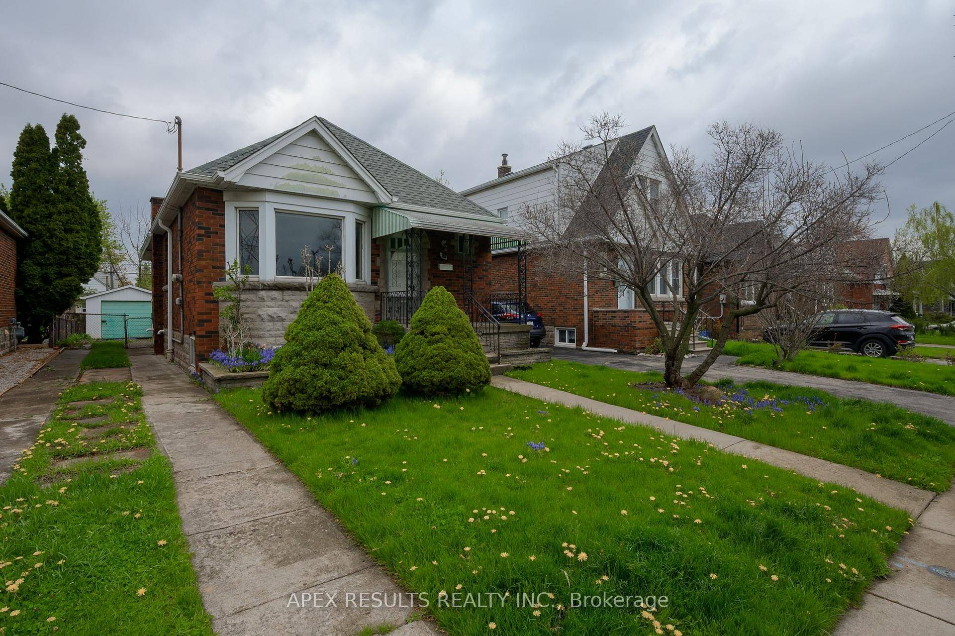 Enjoy this brick bungalow with significant updates already completed.
