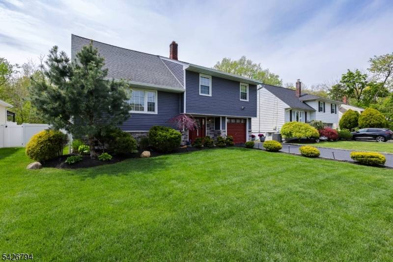 A true standout, this impeccably renovated split level residence offers turnkey living on a quiet, tree lined street in one of the area's most sought after neighborhoods just moments from ...