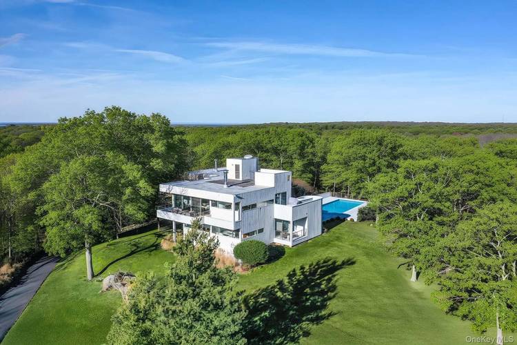 HILLTOP ESTATE WITH HEATED POOL amp ; TENNIS Set on 5 private acres in Water Mill, this chic contemporary offers the rare combination of scale, serenity, and a true resort ...