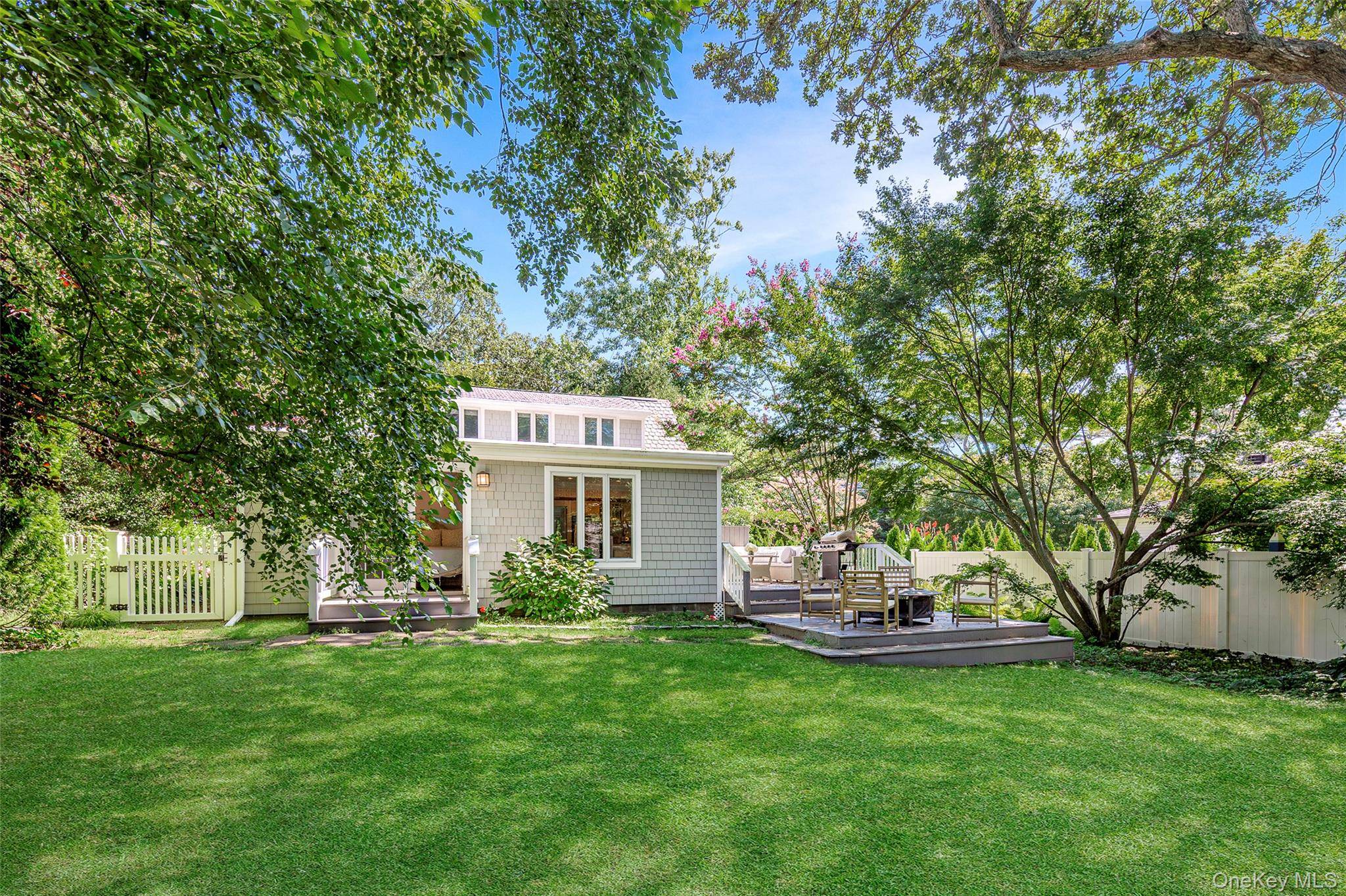 Charming light filled beach cottage just 2 10 of a mile from the iconic Meschutt Beach.