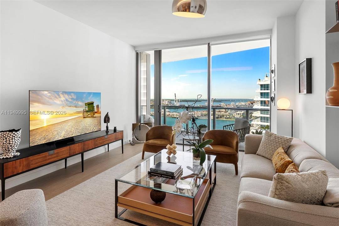 Highest floor 1BR currently available at Five Park with unobstructed bay amp ; sunset views offered fully furnished with a designer package valued at 150K.