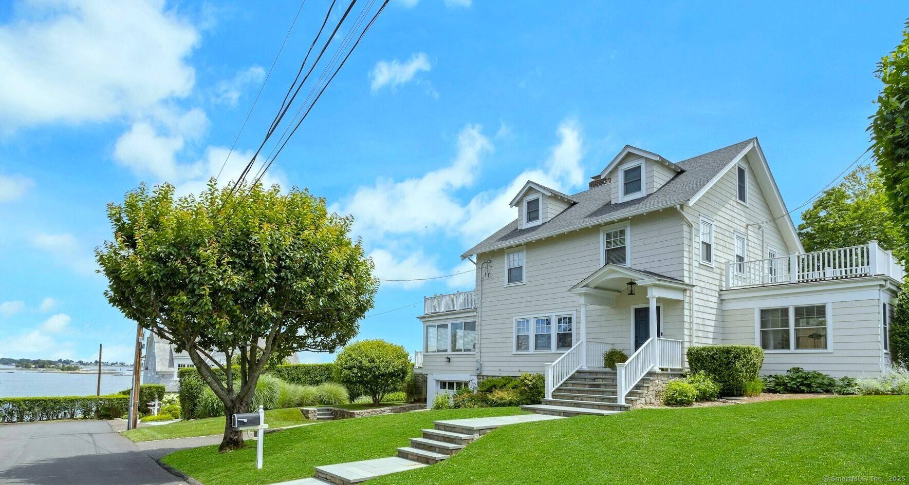 With sparkling water views and a private beach only steps away, this Shippan Point home is coastal living at its best !