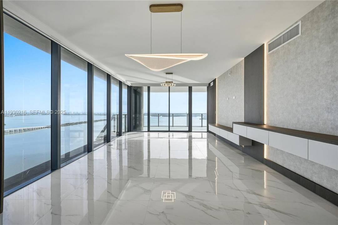 Newly constructed and thoughtfully customized, this refined 48th floor residence showcases elevated design and craftsmanship throughout.