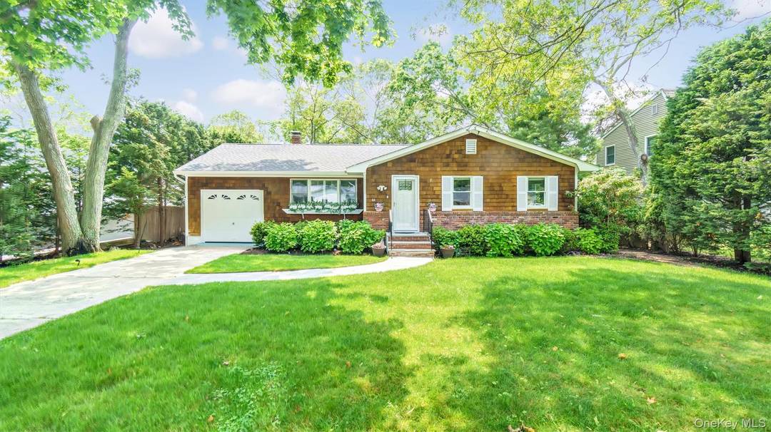 Turnkey Brick Front Ranch with many recent updates, featuring a custom eat in kitchen with sliders to a trex deck overlooking very private, mature landscaped yard and patio.