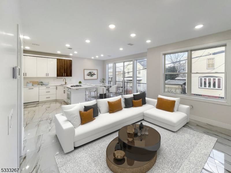 PREPARED TO BE WOWED ! This stunning, newly crafted 2 family home is a beautiful blend of modern convenience and elegant design.