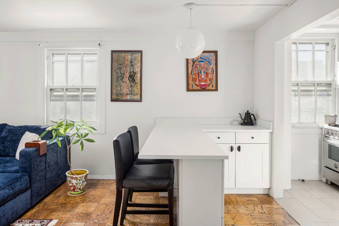 Residence 9B is a bright, high floor corner one bedroom featuring a beautifully renovated kitchen and an airy, sun filled layout with open city views.