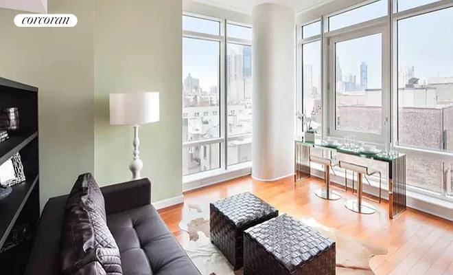 Spacious alcove loft, that can be turned into a one bedroom with a bookshelf separating the living and bedroom areas, in the exclusive icon features soaring 13 ceilings, floor to ...