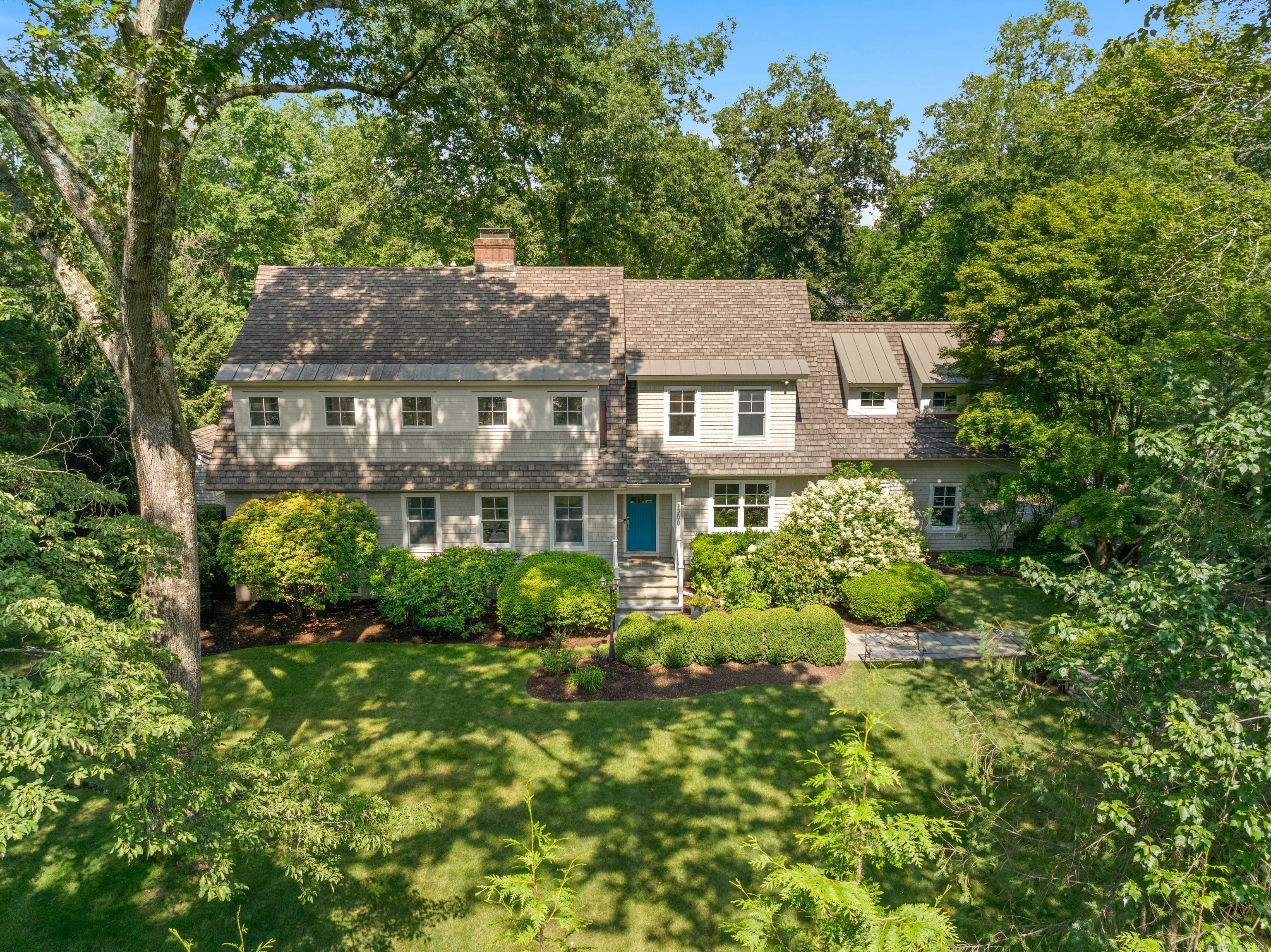 Gorgeous Nantucket Style Retreat with Spacious Layout Private Backyard Set behind stately stone pillars, this stunning Nantucket shingle style home, fully renovated in 2010, offers timeless curb appeal and modern ...