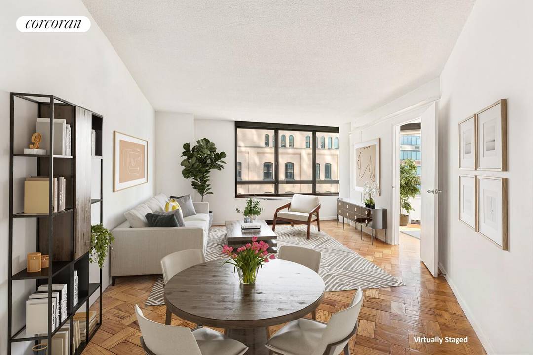Apartment 8N at 630 First Avenue is a beautifully appointed two bedroom, two bathroom condo showcasing sweeping wraparound East River views through oversized windows.