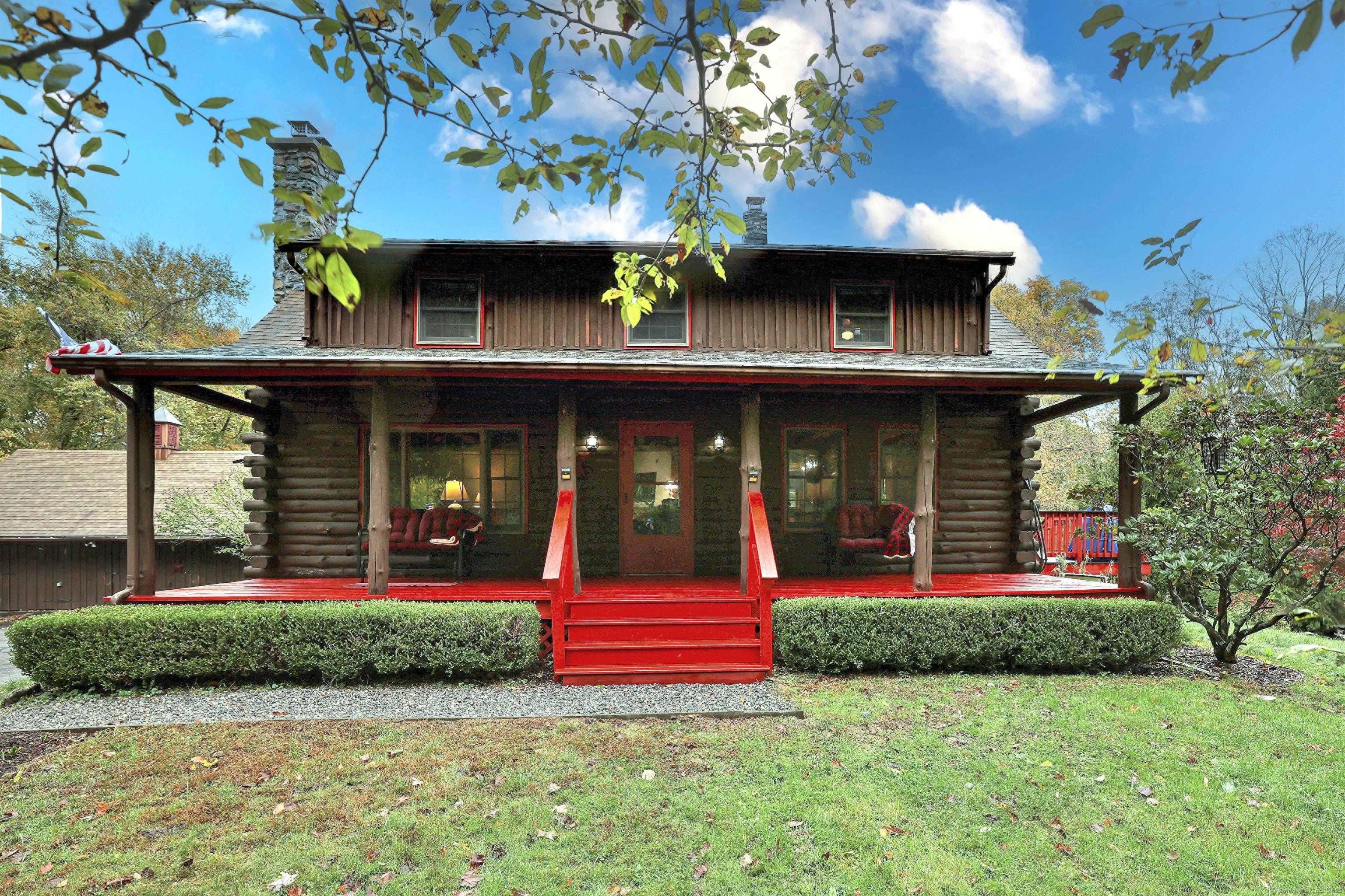 Set back from the road on over 2 acres, this handcrafted full scribe log home offers peace, privacy, and the kind of warmth that only true country living can provide.