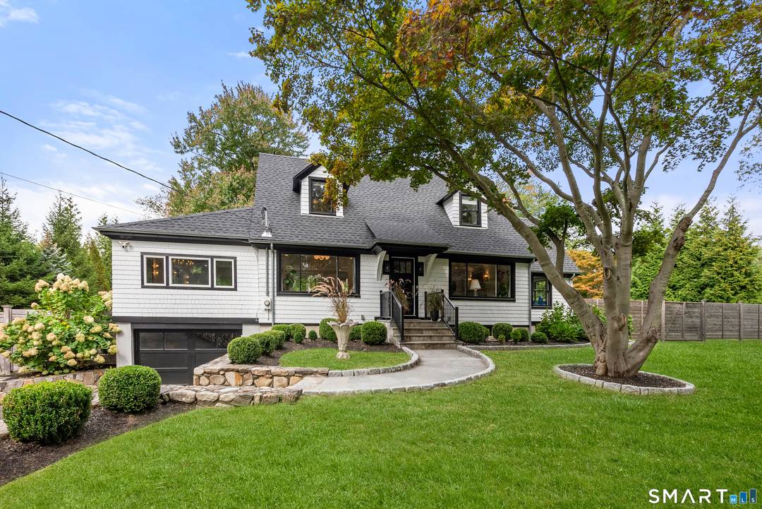 Elegance, style, and thoughtful design converge in this stunning Westport residence, perfectly situated on a full acre of park like grounds.