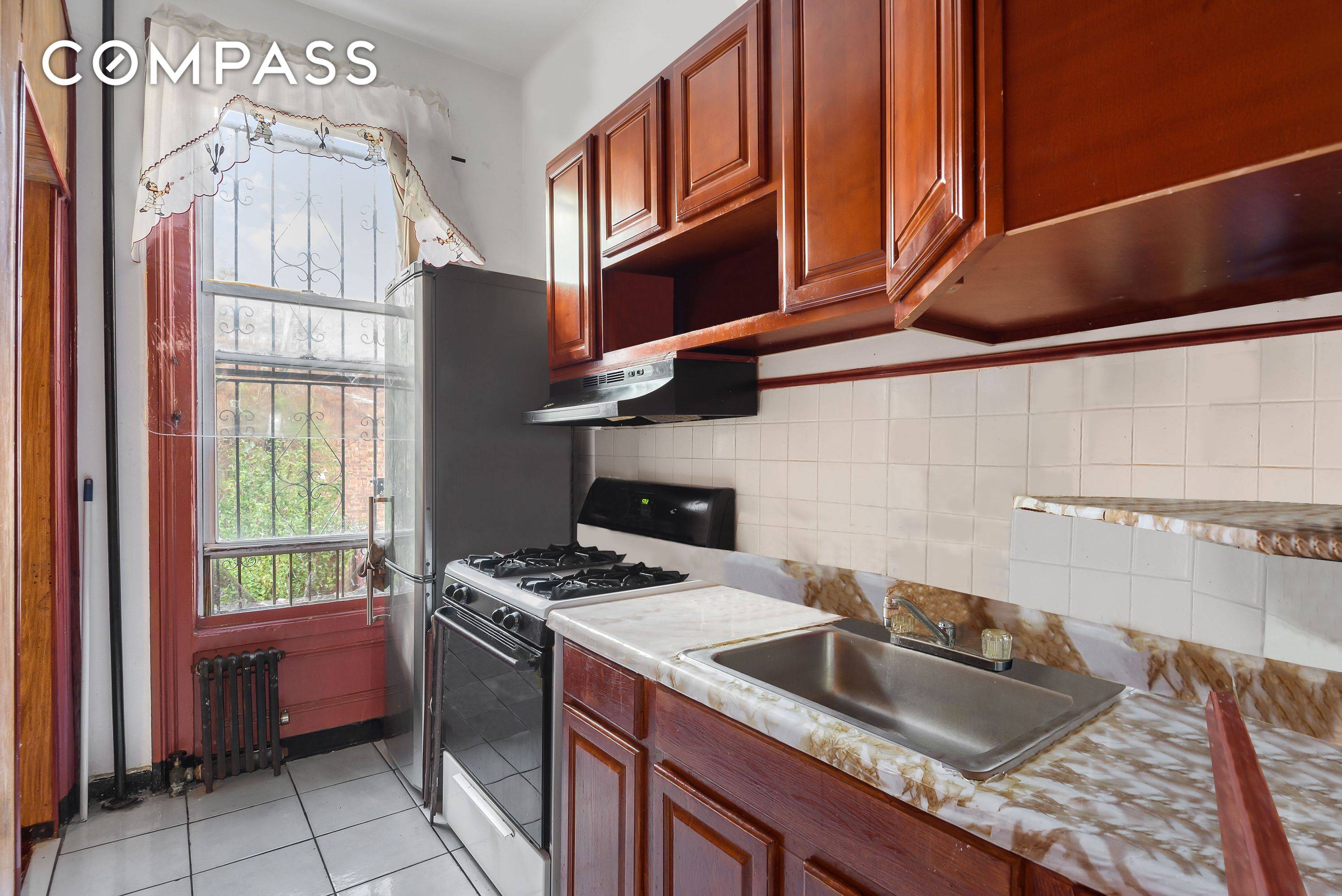 This 1899 Five Bedroom Corner Home is loaded with original detail !