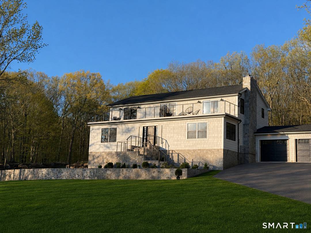 This brand new renovation offers turnkey living in a highly sought after setting perched at the highest point above prestigious Lake Waramaug.